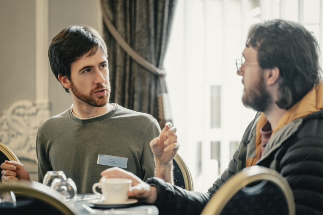 People chatting at a meeting